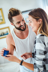 Couple holding credit card and smiling