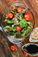 a salad of fresh greens and sesame seeds with soy sauce, Asian national cuisine