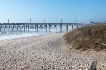 Open beach with pier