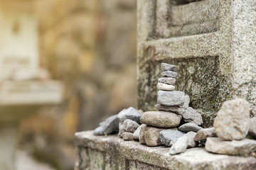 Balance stone on the stone pole at temple.