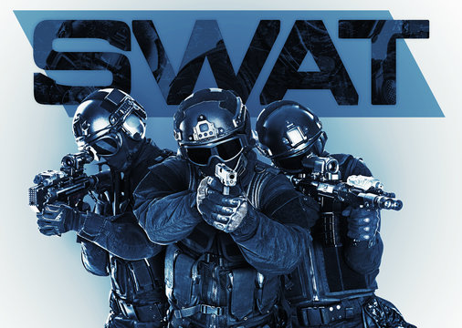 Studio shot of swat police special forces black uniforms pointing terrorists automatic rifle. Tactical helmet goggles. Isolated on white front view
