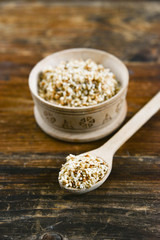 white sesame seed, sesame seed in wooden Cup on natural wooden background in rustic style