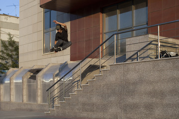 the guy flies through the ladder after jumping on an inline roller skate