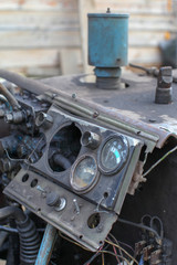 dashboard in an old broken car or tractor  closeup