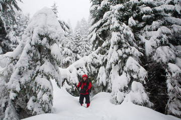 Photographer in the winter forest.