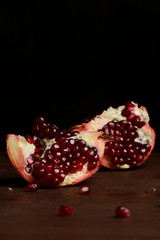 Pomegranate pieces on the table, pomegranate still life