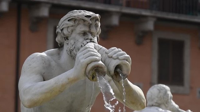 Fountain's marble statue close up in Rome slow motion, fontana del moro piazza navona place