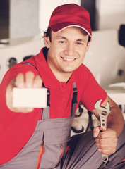 The plumber repairs the pipes. Male specialist plumber repairs.
