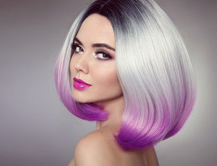 Bob hairstyle. Colored Ombre hair extensions. Beauty Model Girl blonde with short purple hair style...
