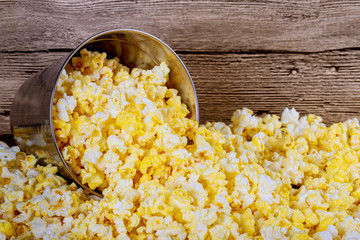 Salt popcorn the wooden background . With space for text