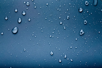 Drops of water on a color background. Gray. Toned