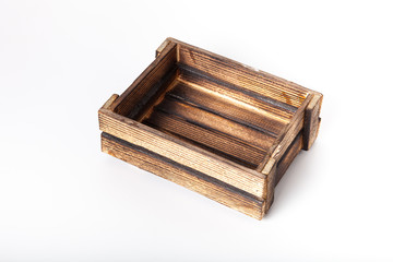 Handmade burned wooden box on a light background