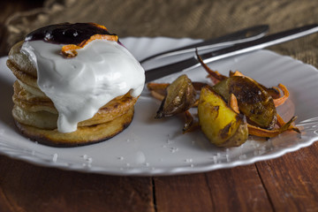 Pancakes with sour cream, baked vegetables and potatoes