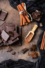 Chocolate bar pieces. Background with chocolate. Sweet food photo concept. The chunks of broken chocolate