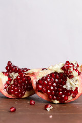 Pomegranate pieces on the table, pomegranate still life