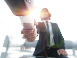 Close-up of two business people shaking hands
