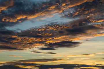 Fototapeta na wymiar Evening sky with strange cloud shape and beautiful color.