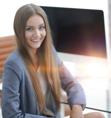 female office employee sitting at a Desk