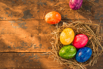 Easter nest with colorful eggs and empty space