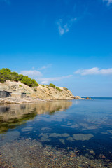 Cala pou des lleo in ibiza with a blue sky