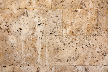 Bricks from old pink tuff in wall 159