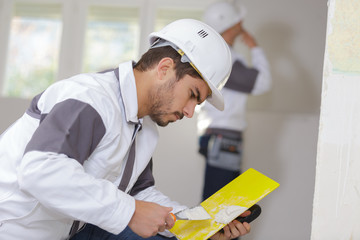 painter mixing the filler