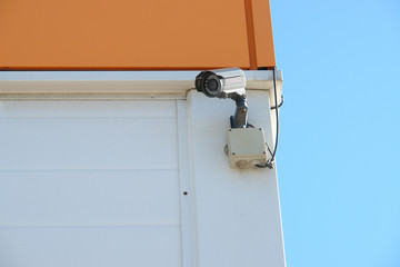 CCTV security camera on the wall outside.