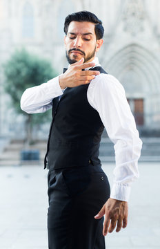 Smartly Dressed Man Shaking Dust Off Shoulder