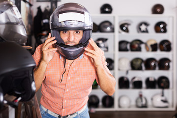 Man trying up moto helmet