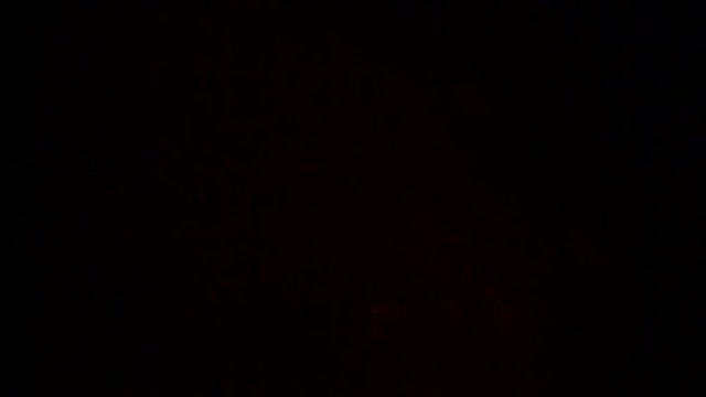 A series of salute balls is replaced by slowly fading sparks