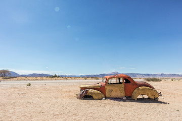 Old and abandoned car in the desert of Namibia, spot known as solitaire.
