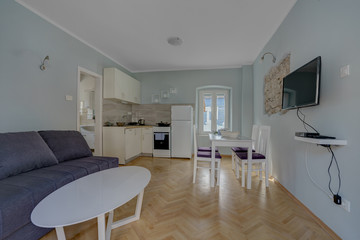 Interior of a living room with view from the window to the sea in a private house