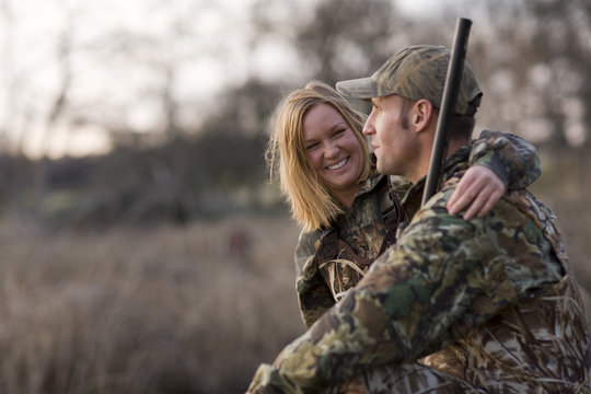 Couple sitting in field