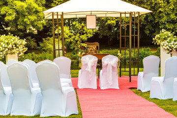 Many wedding chairs with white elegant covers