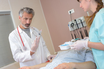 doctor holding a syringe