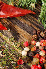 Pepper, dill and spices on a wooden background. Selective focus. Vertical shot.