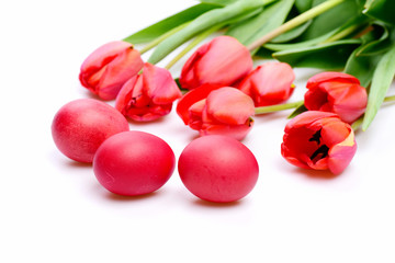 Bunch of flowers near Easter eggs. Bouquet of spring tulips
