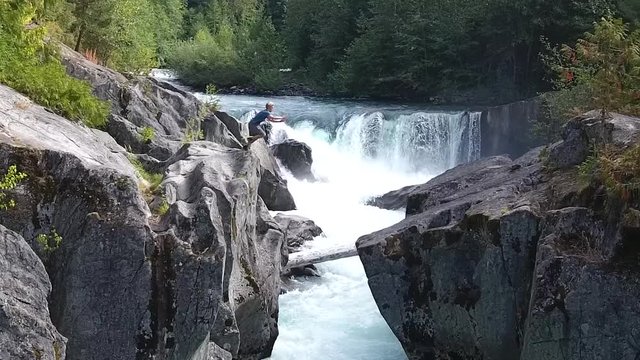 High risky parcour jump over a river in slow motion