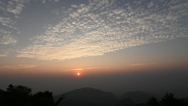 Timelapse 4k video of beautiful sunrise with movement cloud  and  silhouette mountain background