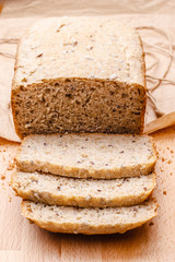 Sliced wholemeal bread on cutting board