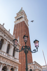 Fototapeta na wymiar St. Mark Square Campanile. Clock Tower of Venice against clear sky, Italy.