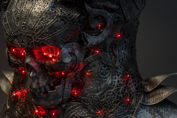 silver skull with red leds lights in eye sockets, handmade design cosplay or fantasy style