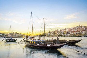Fototapeta na wymiar Downtown cityscape by Douro river with old boats, Porto, Portugal