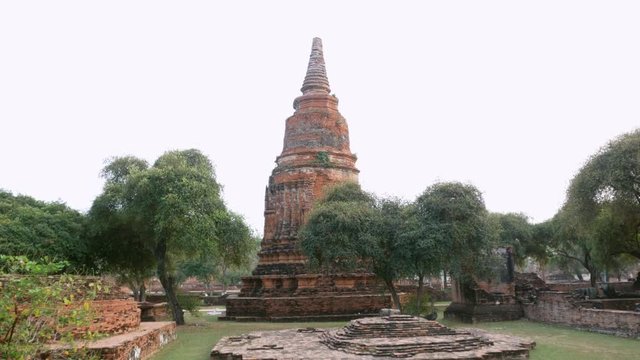 Gimbal shot, walk through the door to see the pagoda at Ratchaburana temple, Ratchaburana temple is a historic site in Phra Nakhon Si Ayutthaya Historical Park, Thailand.