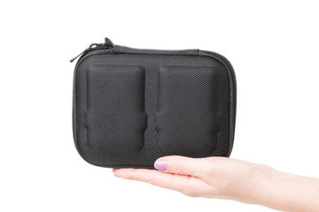 Close up view of woman hand holding black case for batteries for quadcopter
