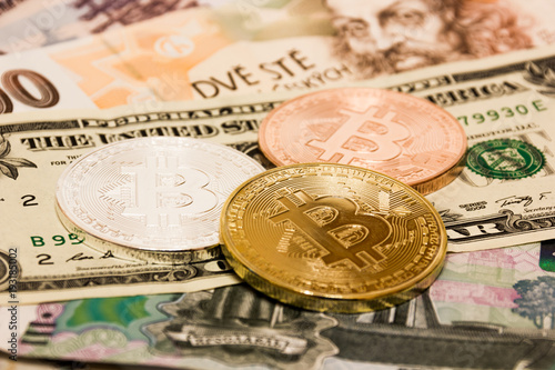 Symbolic Coins Of Bitcoin On Banknotes Us Dollars Czech Crowns Symbolic Coins Of Bitcoin On Banknotes Us Dollars Czech Crowns And Russian Rubles