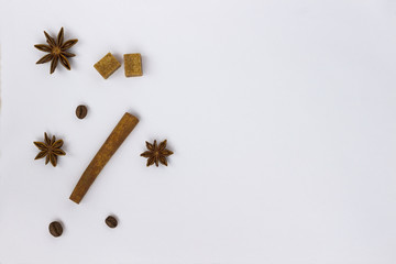 Spices: star anise and cinnamon sticks on white background. Close up. Top view.