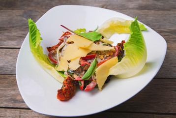 Salad of meat, vegetables, cheese and sauce