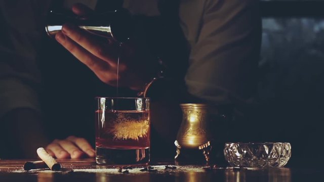 Barman make a cocktail