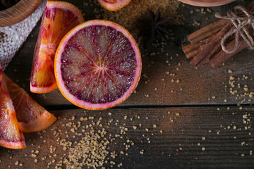 Obraz na płótnie Canvas Fresh red orange fruit, anise, cinnamon and brown sugar